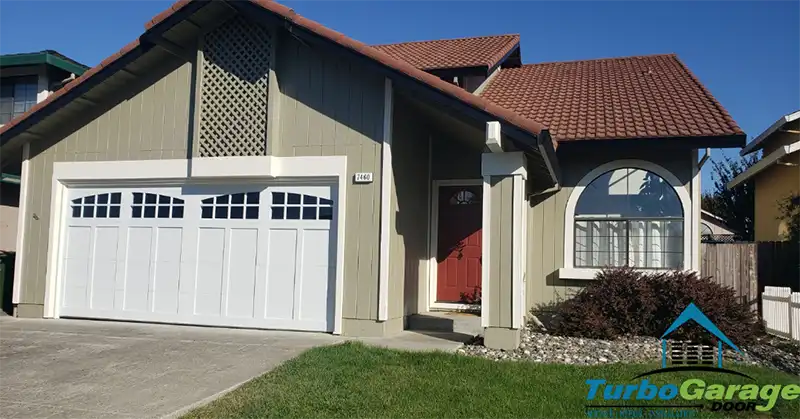 Carriage house style garage door installed by Turbo garage Door