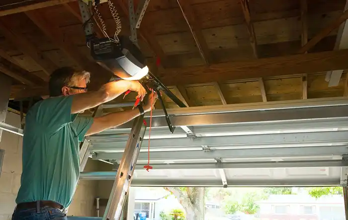Technician repairing a garage door
