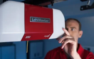 Technician working on a garage door opener