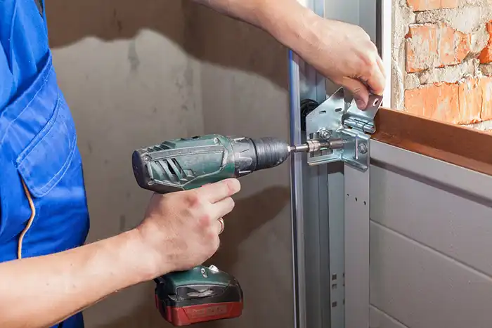 Technician repairing a garage door